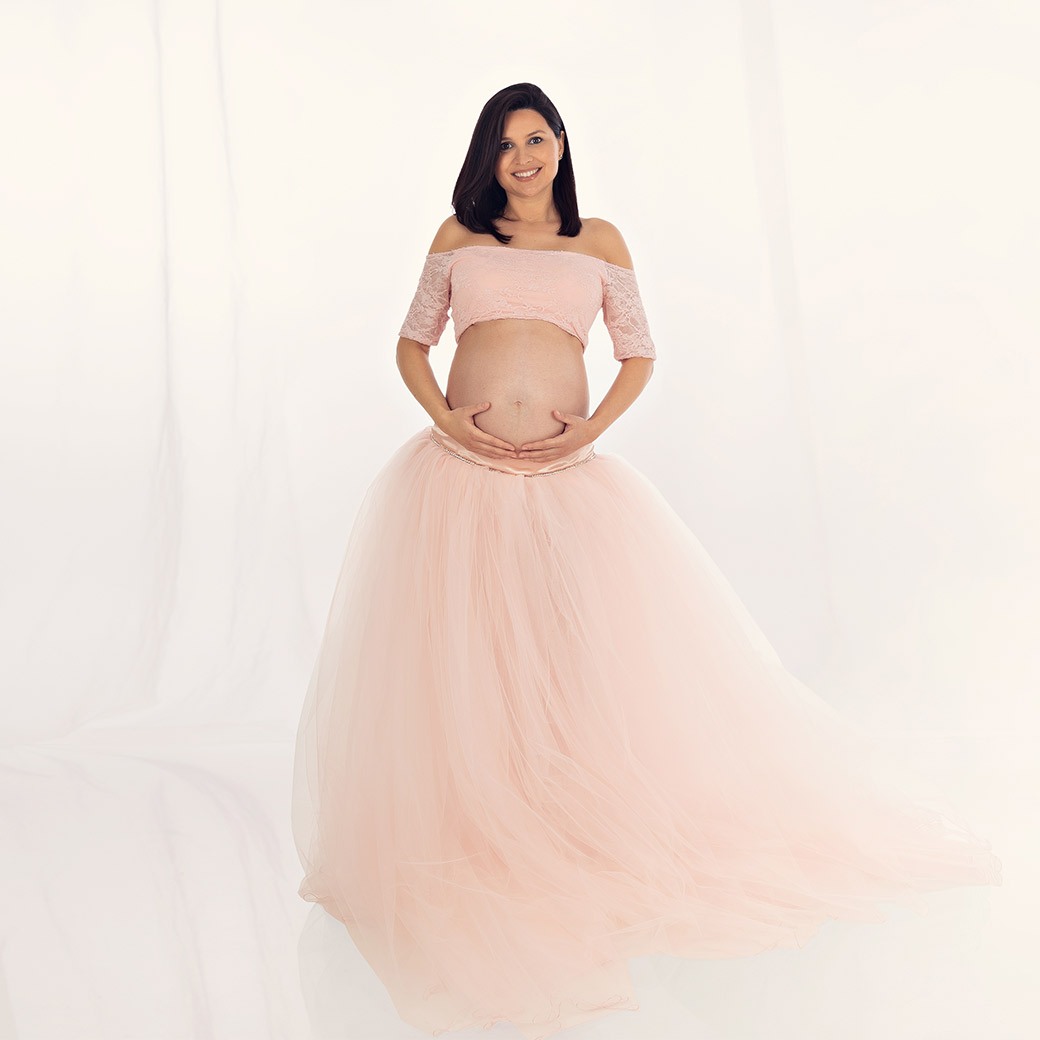 Schwangerschaft Fotoshooting mit rosa Prinzessinnenkleid